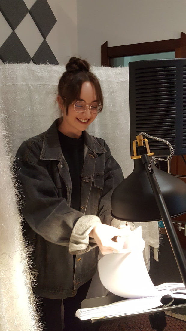 Lisa finder her place in the 269 page book of lines.