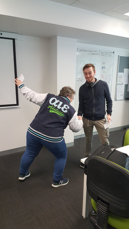 Kathy presenting prize envelope to Dylan Clarke.