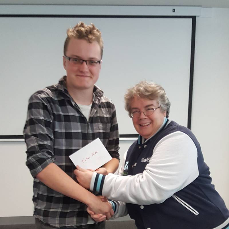 Kathy presenting prize envelope to Max Winzar.