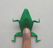 Origami frog showing how to make it jump