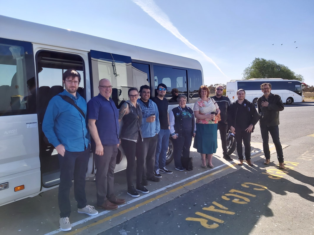 By the bus at Port Wakefield.  Ryan, Dan, Brenna, Arthur, Pat, Kathy, Liz, Ryan, Ryan's motorbike, Mikey, Mike